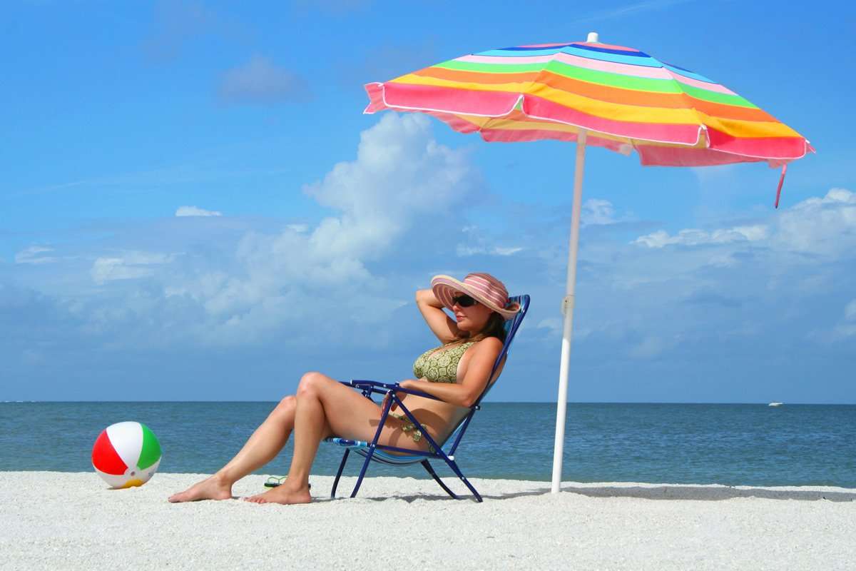 Beach umbrella vs. sunscreen. Which works better?