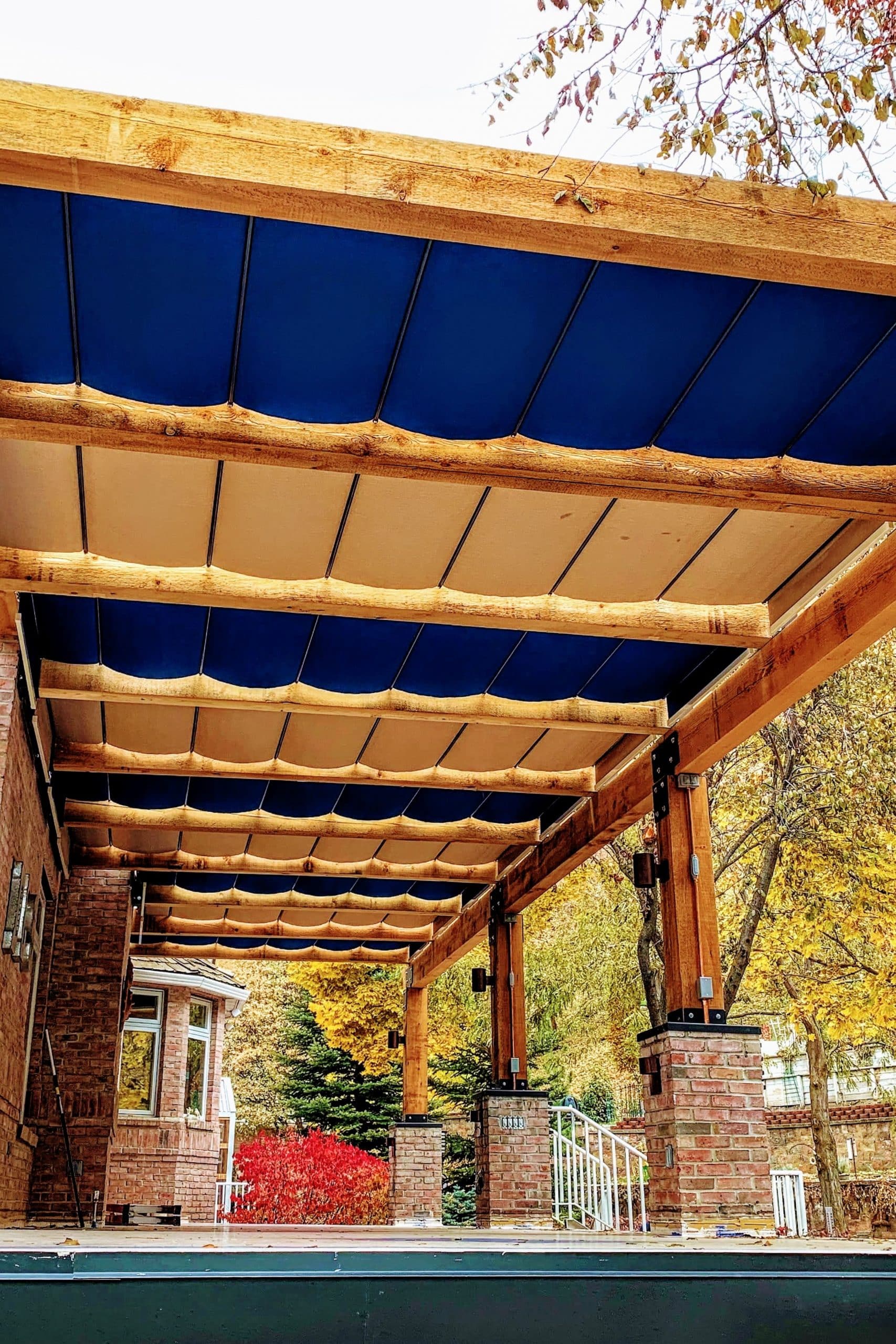 Beautiful Blue and Tan retractable fabric canopies over new deck ...