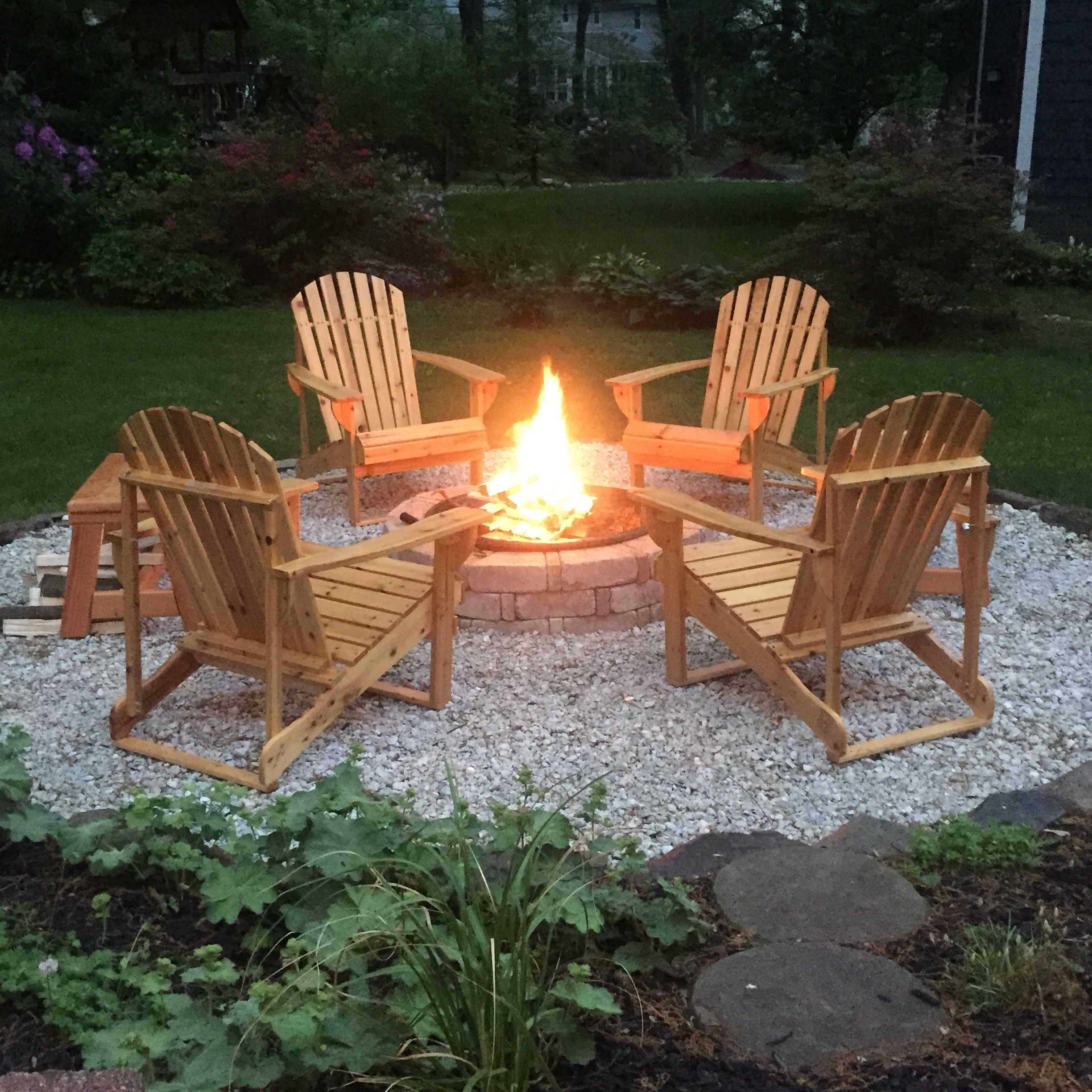 DIY backyard fire pit complete with adirondack chairs and handmade ...