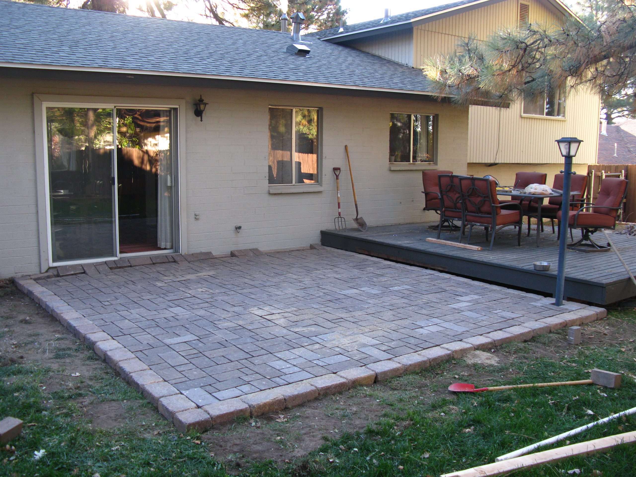 How to Build a Paver Patio on a Cement Slab: Part 3  Sand ...