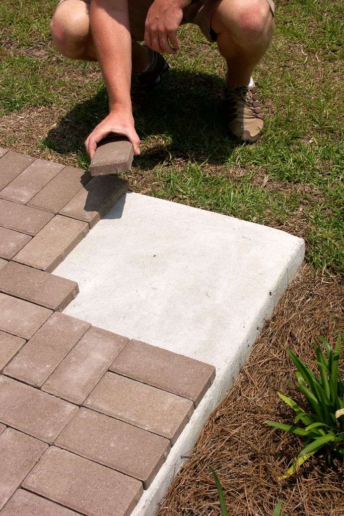 how to put pavers over concrete