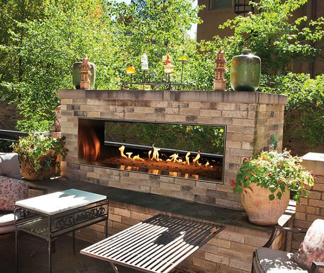 Is it safe to use a fire pit under a covered patio?