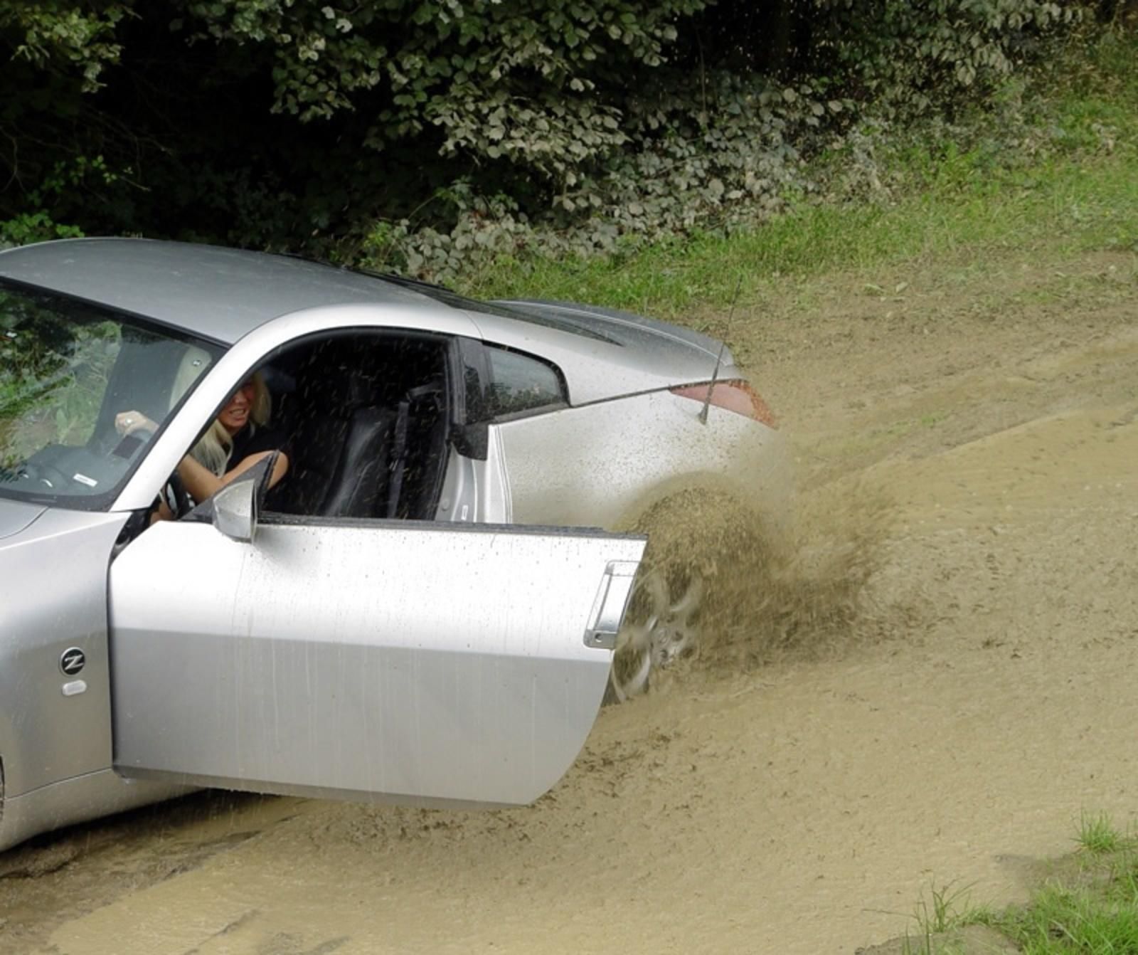 Nissan 350Z Stuck In The Mud By A Blonde