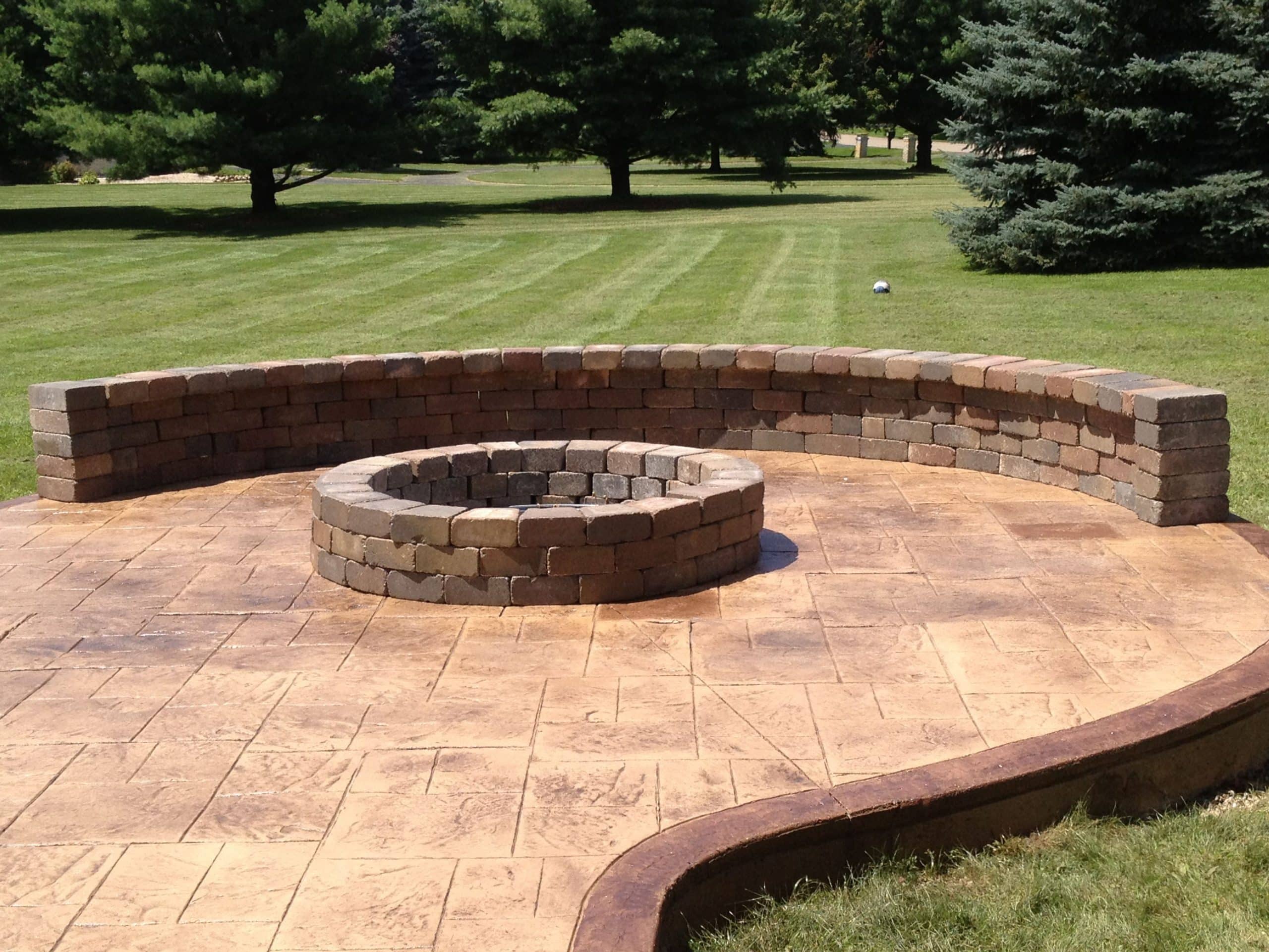 Stamped Concrete Patio with Fire Pit and Sitting Wall, Clarskon, Mi ...