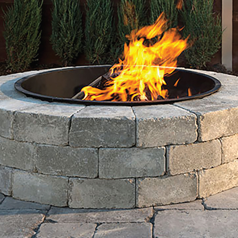 stone round outdoor fireplace