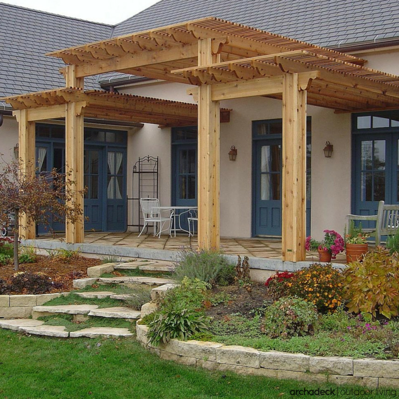 Tiered, entryway pergola designed and built with heavy timber.