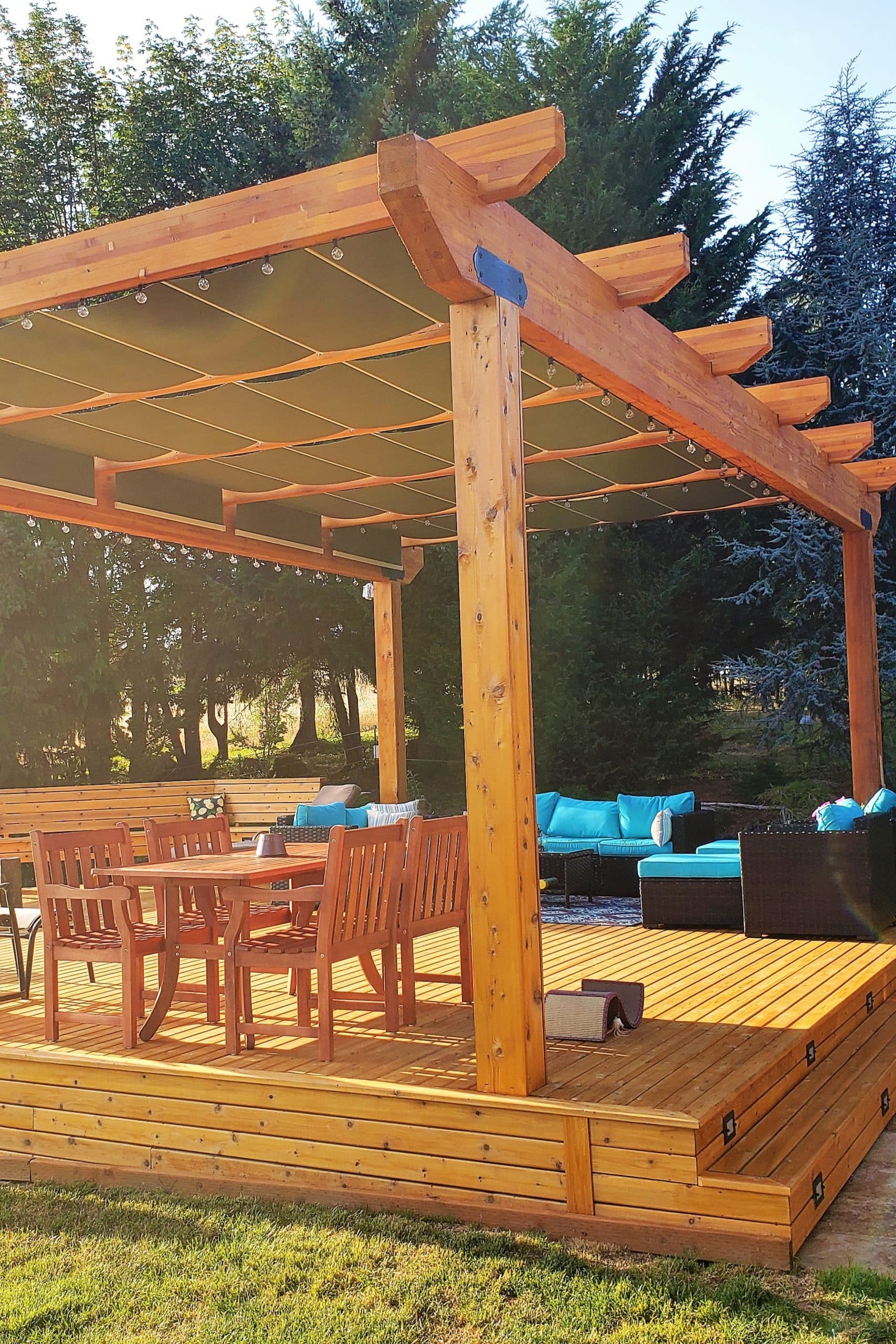 Wood pergola with five large retractable fabric canopies